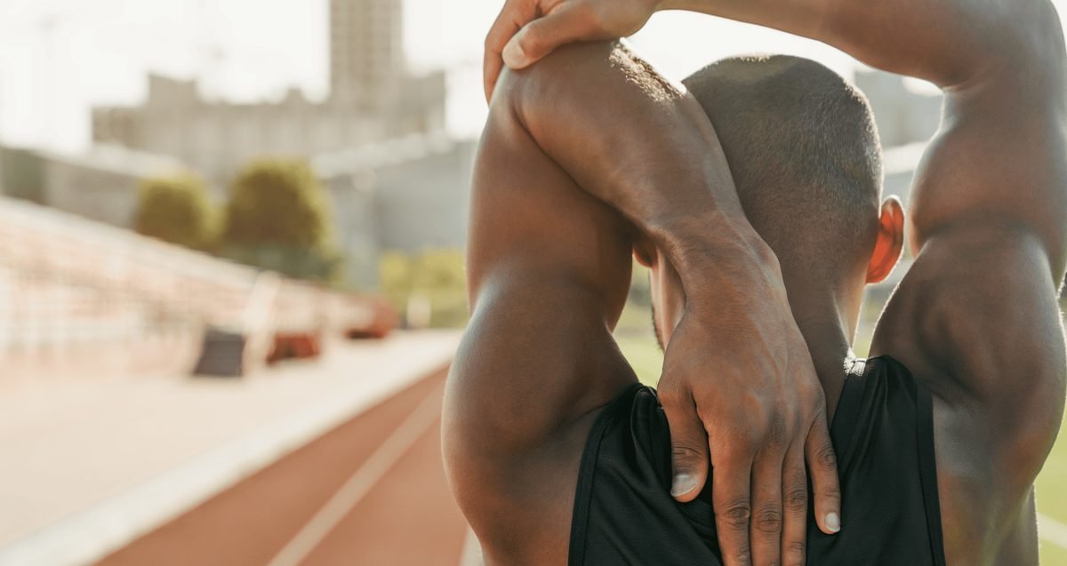 Frozen Shoulder: Non-Surgical Treatment Options for a Stiff, Painful Shoulder in Palm Beach Palm Beach orthopedist assessing shoulder range of motion in a patient with frozen shoulder
