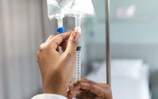 Comparison of oral supplement capsules and an intravenous infusion bag on a clinical counter